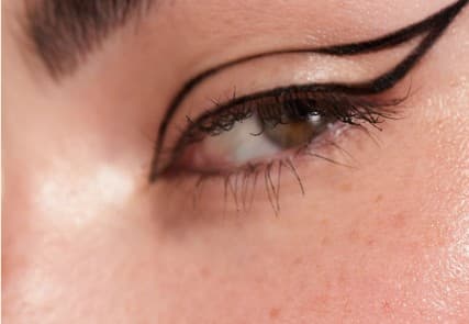 Close-up of an eye with graphic winged liner